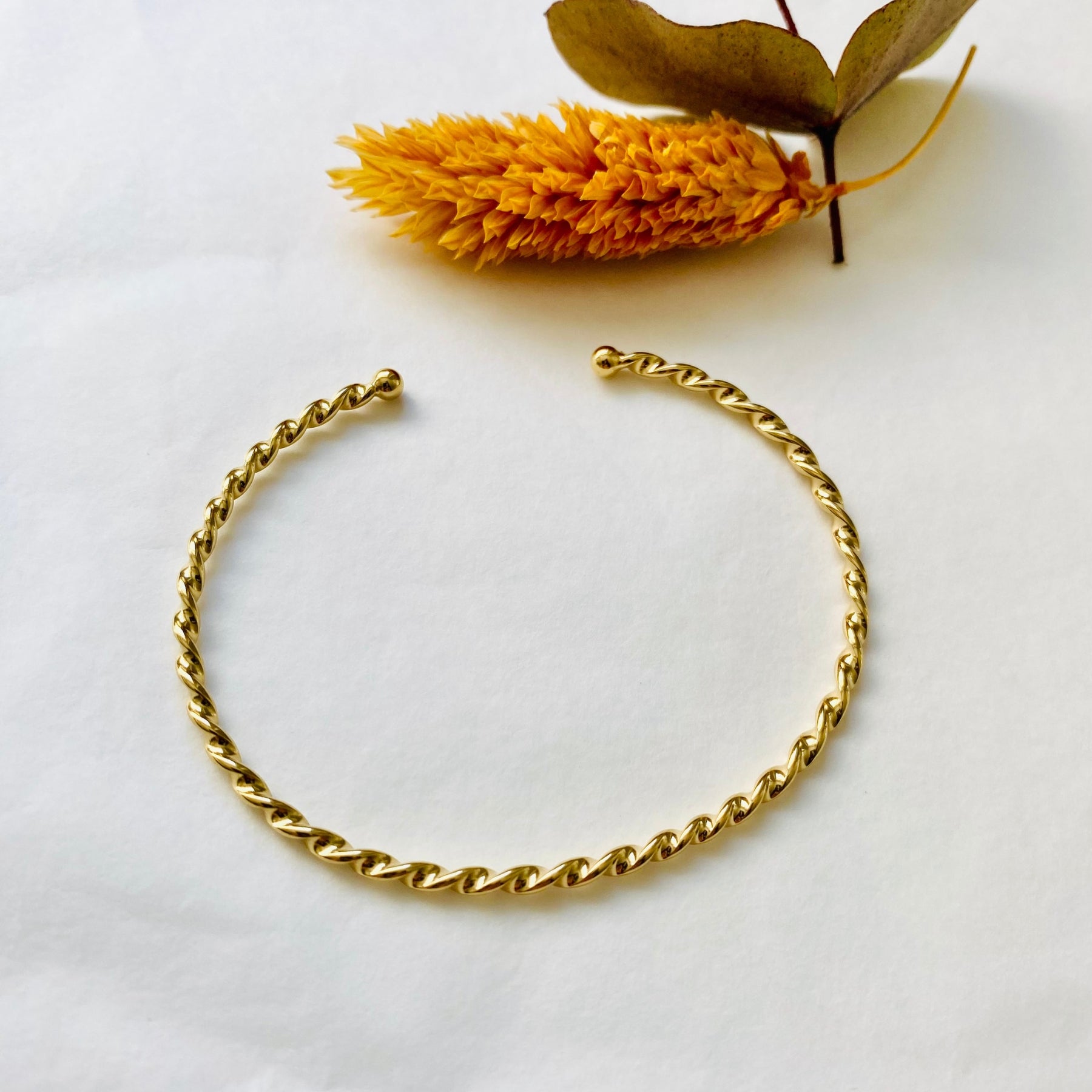 Alma gold twisted bangle bracelet